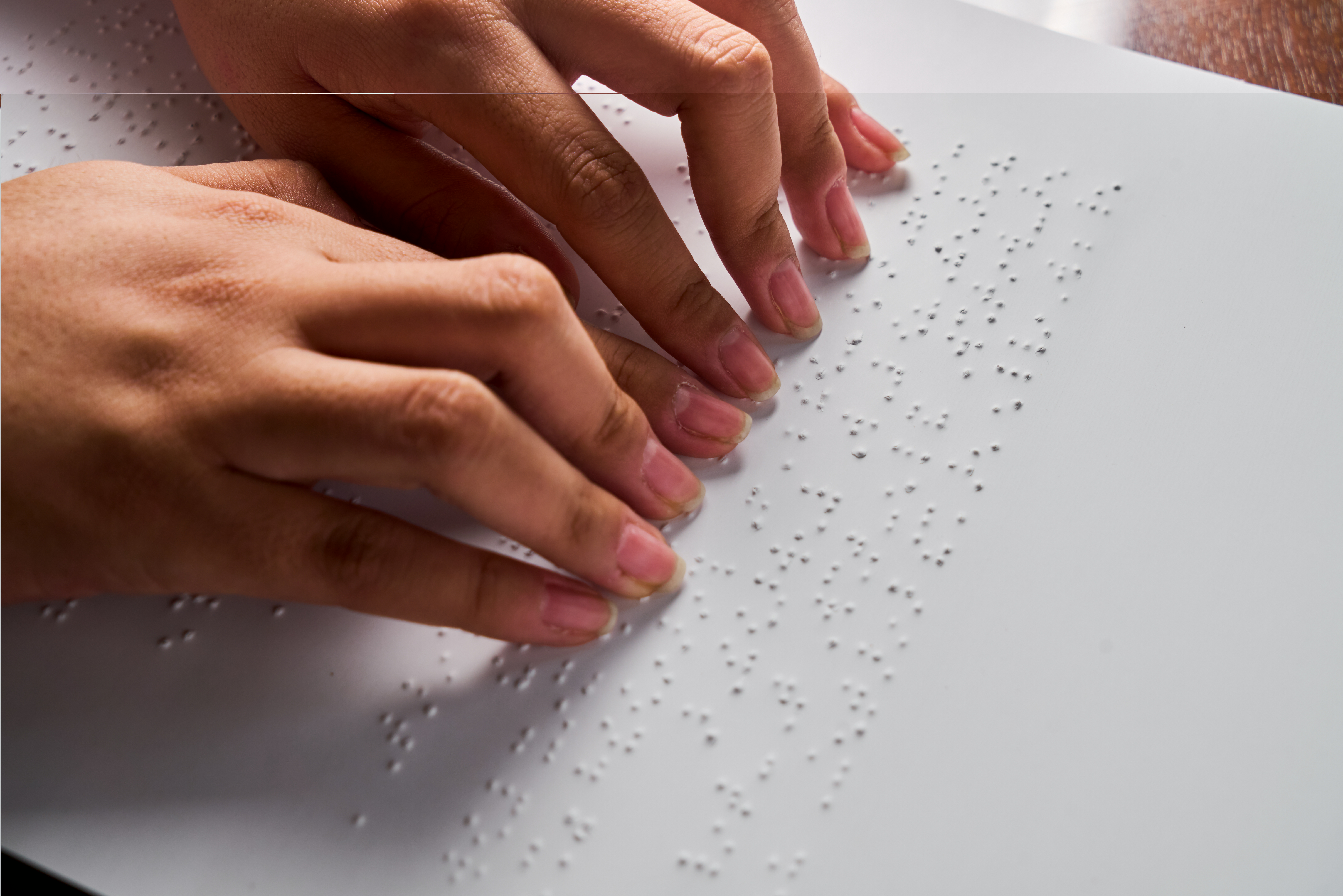 woman-reading-braille-text-on-page-2024-12-05-23-08-41-utc.jpg